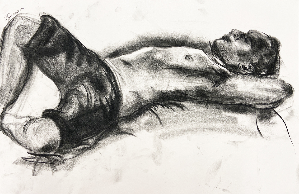 A charcoal figure drawing of a reclined figure laying on their back with their hands behind their head.