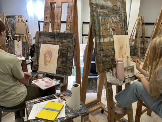 Portfolio Clinic participants painting in studio