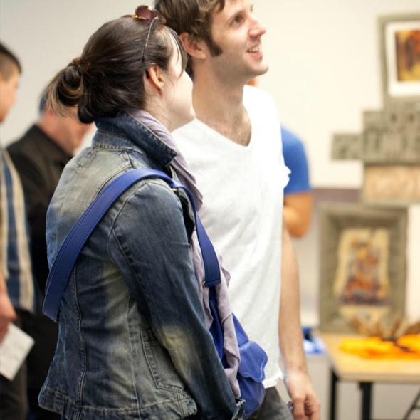 People exploring a gallery.