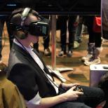 Man sitting while wearing a virtual reality headset